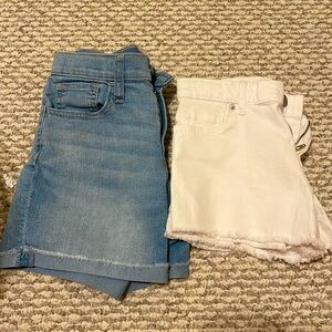 2 pairs of size 10 denim shorts. Neither pair has ever been worn.